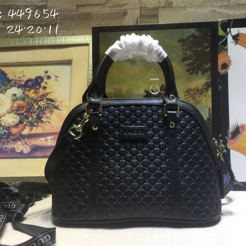 G*u*i top handle bags